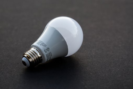 This is an image of an LED light bulb with a white ceramic base and a white frosted glass bulb.